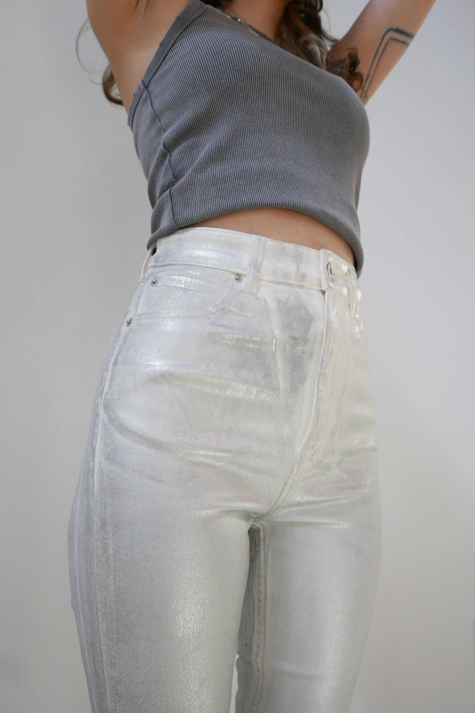 Coated High Rise Skinny - Metallic Icy Grey Model front close up